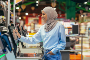 Woman at self checkout